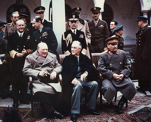 Franklin D. Roosevelt (front row, center) at 1945 Yalta summit with Winston Churchill (left) and Joseph Stalin (right). Public domain image.