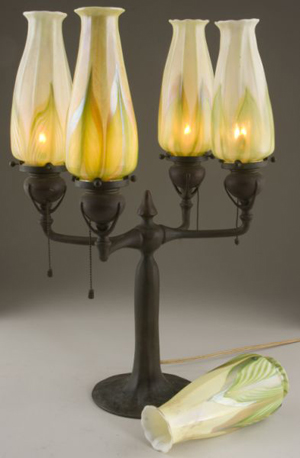 Tiffany Studios fitted this four-arm electrified candelabra form lamp with Favrile glass shades. The estimate is $5,000-$8,000. Image courtesy Leland Little Auction & Estate Sales Ltd.