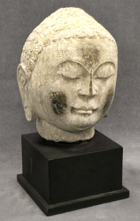 This 12-inch Chinese carved limestone head of Buddha is from the Sui Dynasty, circa A.D. 618-700. Having extensive provenance, it carries a $10,000-$15,000 estimate. Image courtesy of William J. Jenack Auctioneers.