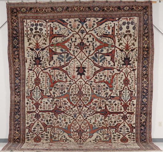 Two corners of this late-19th-century Garrus Bidjar carpet from northwest Persia have been rewoven. It is 18 feet x 11 feet 6 inches and has a $25,000-30,000 estimate. Image courtesy Skinner Inc.