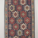 This distinctive Kuba Kelim rug, 11 feet by 5 feet 7 inches, was woven in northeast Caucasus in the last quarter of the 19th century. It has a $6,000-$8,000 estimate. Image courtesy Skinner Inc.