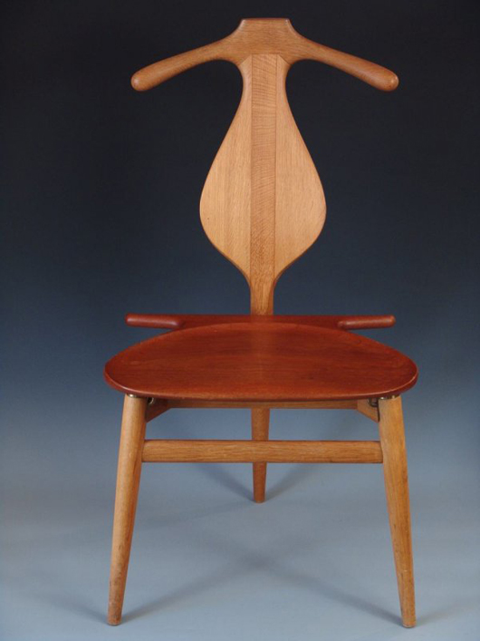 Hans Wegner designed this chair to neatly hang a suit. Johannes Hansen, Denmark, manufactured the chair in 1953. It has a $1,000-$3,000 estimate. Image courtesy of Dirk Soulis Auctions.