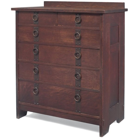 Gustav Stickley’s no. 906 chest of drawers has paneled sides with thru-tenon construction. Marked by a branded signature, the large chest bears a $7,000-$9,000 estimate. Image courtesy Treadway Gallery.