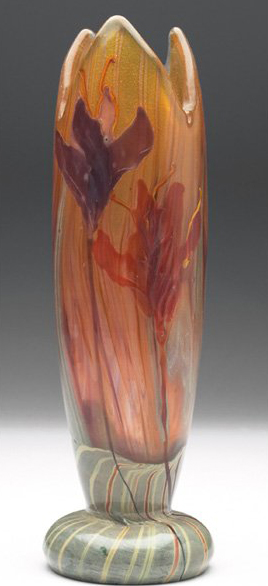 This unusual Gallé vase in marbled glass with a marquetry design of colorful lilies is 8 3/4 inches high. Retaining its original paper label, the vase has a $25,000-$35,000 estimate. Image courtesy Treadway Gallery.