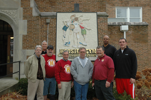 Hoosier Gym directors (front row from left) include Neil Shaneyfelt, Mike Smoot, Mervin Kilmer, William Gorman and Tom Hoepf. In the back row (from left) are Dave Lower, Athletes in Action events director; Clark Kellogg; and Luke Simons, Athletes in Action men’s basketball staff. Photo courtesy of Valerie Zimmerman, Athletes in Action.