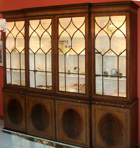 Baker Furniture likely made this massive breakfront china cabinet when the company was still located in Michigan. It has a $12,000-$15,000 estimate. Image courtesy of DuMouchelles.
