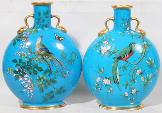 Colorful birds on blossoming branches are painted in slip on this pair of Minton moon flasks, shape no. 1348. The pair is estimated at $2,500-$3,500. Image courtesy of DuMouchelles.