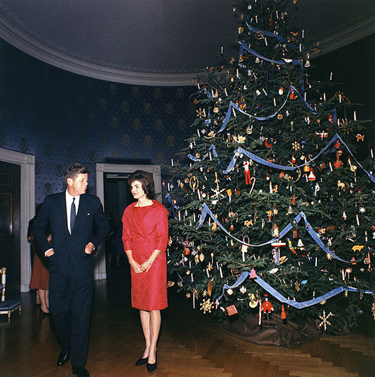 President John F. Kennedy and First Lady Jacqueline Kennedy beside the White House Blue Room Christmas tree in 1961. Photo by Robert Knudsen, White House Collection.