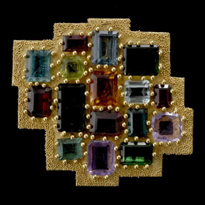 This Ed Wiener gold pendant brooch is studded with 16 gemstones. It carries a $4,500-$6,000 estimate. Image courtesy of Michaan’s Auctions.