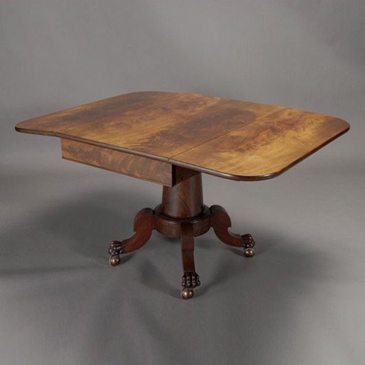 Classical Revival flame mahogany drop-leaf pedestal table (estimate: $1,000-$1,500). Image courtesy of Michaan’s Auctions.