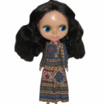 This original 1972 Blythe doll, 11 1/2 inches tall, sold in an online auction for $920. She has a tagged dress and eyes that change to four different colors, but her face is slightly damaged and her hairdo is incorrect.