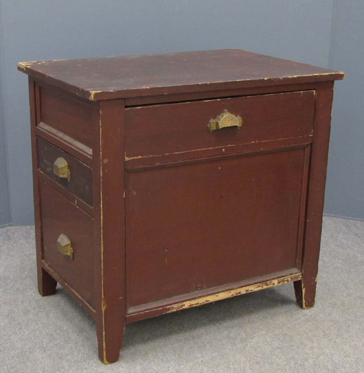 Original cast-iron pulls enhance this Shaker painted pine sewing cabinet with dovetailed construction. It measures 27 1/2 inches tall. The estimate is $4,000-$6,000. Image courtesy of William J. Jenack Auction Gallery.