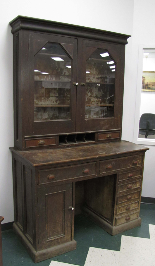 This painted tiger-maple store desk-secretary is also attributed to the Shakers. It is 86 inches high by 54 inches wide. It has a $7,000-$10,000 estimate. Image courtesy of William J. Jenack Auction Gallery.