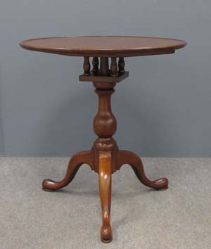 Attributed to Eliphalet Chapin is this Connecticut River Valley cherry birdcage tilt top tea table with molded edge. It is 29 inches high by 26 inches in diameter. The estimate is $6,000.00-$10,000. Image courtesy of William J. Jenack Auction Gallery.