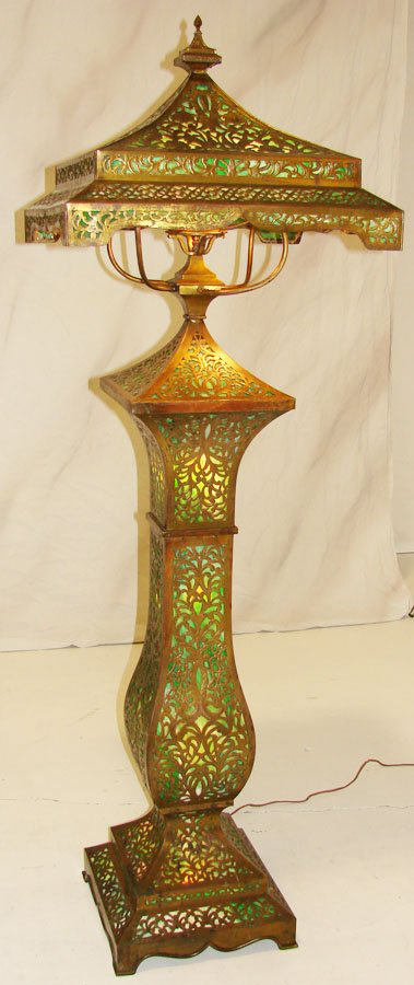 Apollo Studios, New York, produced this slag glass and brass overlay floor lamp, which stands 74 inches high. The rare lamp has a $4,000-$5,000 estimate. Image courtesy of North Georgia Auction Gallery.