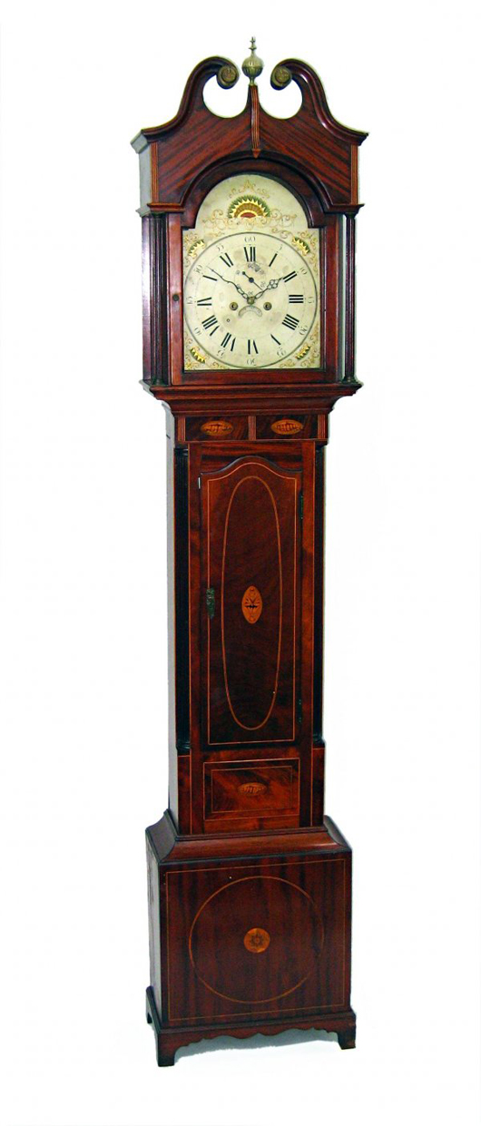 Made in New York or New Jersey, this Federal tall case clock in a dense and dark solid mahogany case made $6,900. Image courtesy of Gordon S. Converse & Co.