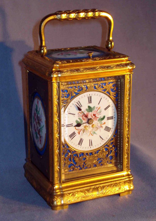 Sevres inserts accent this fine gilt bronze and porcelain paneled carriage clock. It sold for $4,025. Image courtesy of Gordon S. Converse & Co.