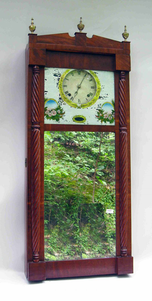 The day's top lot was a reverse-painted and mirror and wood cased wall clock by Joseph Ives, which sold for $9,200. Image courtesy of Gordon S. Converse & Co.