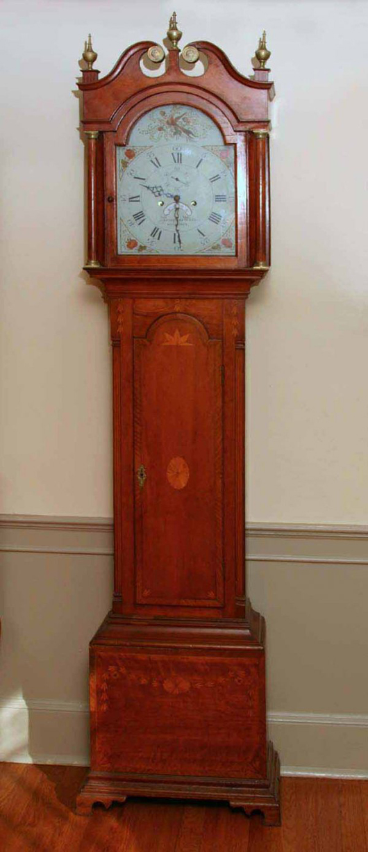 Capt. John Work, a Revolutionary War soldier from Ashford, Conn., was the original owner of this Peregrine White tall case clock. The inlaid cherry Chippendale case was made by David Goodell. It has a $10,000-$15,000 estimate. Image courtesy of Carl W. Stinson Inc.