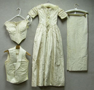 Victorian cream silk brocade wedding gown, circa 1877, offered together with matching bodice and a silk groom's vest, sold for $475 + buyer's premium on Dec. 14, 2006 at Skinner Inc. Image courtesy LiveAuctioneers.com Archive and Skinner Inc.