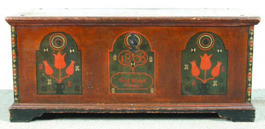Triple ‘tombstone’ panels highlight this fine Lebanon or Dauphin County, Pa., dower chest dated 1808. Missing its till, the finely decorated trunk has a $3,000-$5,000 estimate. Image courtesy of Conestoga Auction Co.