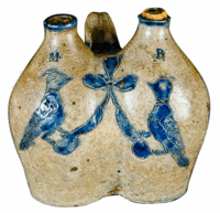 Two pheasants decorate this rare 6 1/4-inch-high stoneware gemel jug. Although small, it is rare and brought $24,725 at a recent Crocker Farm pottery auction in Riderwood, Md.