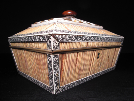 A 19th-century Anglo-Indian wood box decorated with porcupine quills, ivory, bone and horn closed at $862.50.