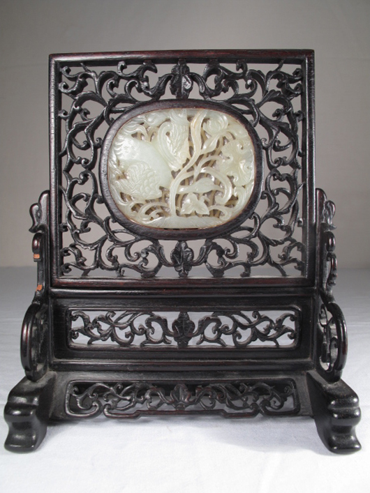 This Chinese Qing Dynasty (late 19th-early 20th century) carved jade and camphorwood screen measures a diminutive 3 inches by 2½ inches. It realized an auction price of $1,495.