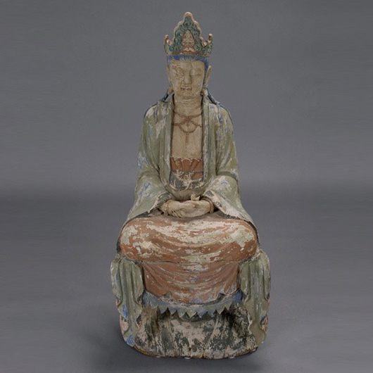 Guanyin sits upon a lotus blossom base. The 47-inch-tall polychrome wooded figure is from the Ming Dynasty and has a $2,000-$3,000 estimate. Image courtesy of Michaan’s Auctions.