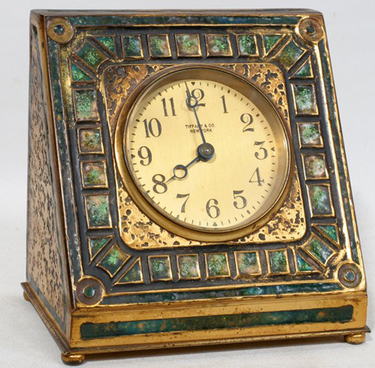 ‘Louis C. Tiffany Furnaces Favrile 360’ is marked on this mosaic enamel and doré Art Deco bronze clock, model no. 360. Produced circa 1920, the clock has a $4,000-$6,000 estimate. Image courtesy of DuMouchelles.