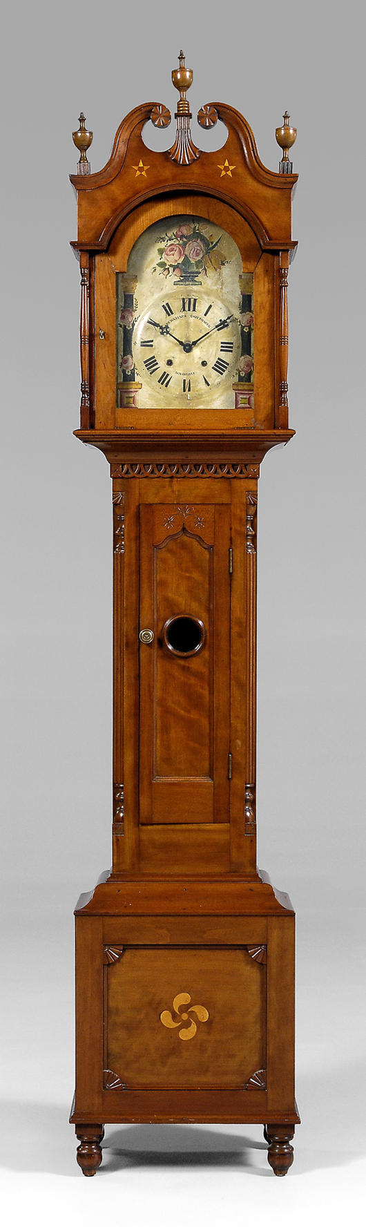 From the top, note the shell-carved finial plinth, elaborately decorated waisted case, central bull’s-eye window and turned feet on this elegant early 19th-century Kentucky tall case clock. It has a $10,000-$20,000 estimate.