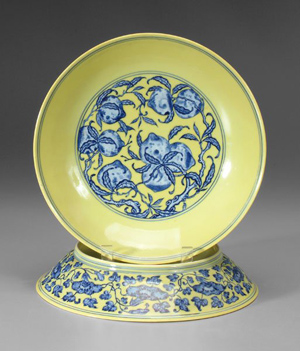 These Imperial bowls are slightly different. One is 2 inches by 10 5/8 inches, the other 2 1/8-inches by 10 1/2 inches. They are decorated front and back and have underglaze blue seal marks for Qianlong (1736-1795). From the estate of Thomas E. Cody, the bowls are estimated at $50,000 to $80,000.