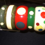 Original Bakelite bangles with newly added Bakelite polka dots. Image courtesy Florida Antique Shows/Puchstein Promotions.