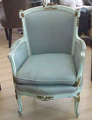 A bergere is a French upholstered armchair with closed upholstered sides.