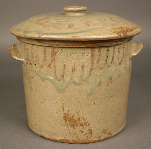 Both the lid and body of this rare Edgefield, S.C., butter crock were decorated and marked “Chandler Maker.” It sold  for $18,160. Image courtesy of Case Auctions.