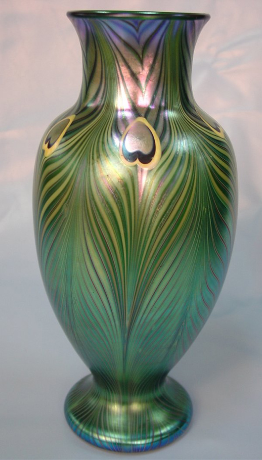 Signed ‘L.C. Tiffany Favrile,’ this 11-inch vase has a $1,200-$2,000 estimate. Image courtesy of Stevens Auction Co.