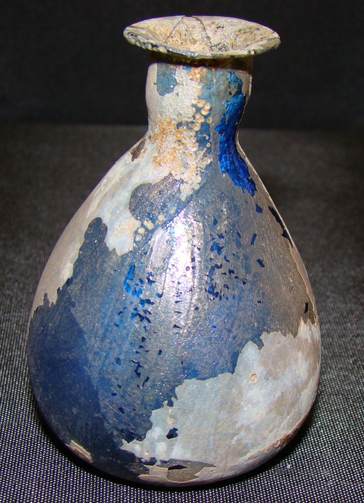 Roman, rare small dark blue colored glass flask, circa 100-300 AD, $900-$1,200. Image courtesy Malter Galleries.