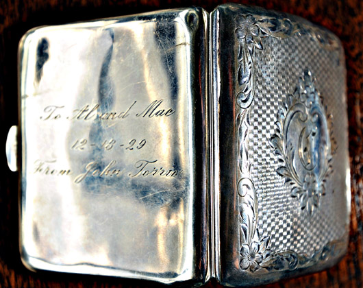 Al Capone's cigarette case, suitably battered and bruised, which will be on view at the loan exhibition entitled 'Heros or Villlains?' at the British Antique Dealers' Association Fair in London in March. 