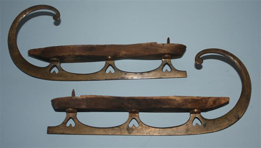 Cutout hearts decorate the brass blades of these unmarked skates dating to 1850-1870. Image courtesy of Karen Cameron, Antique Ice Skate Club.