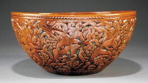 This rare large-scale bowl (D. 15 inches) was designed and carved by Walter Anderson and glazed by his brother Peter around 1930. Decorated with bacchantes and grapes, the example sold for $23,900 at the Louisiana Purchase Auction in November. Image courtesy Neal Auction Co.
