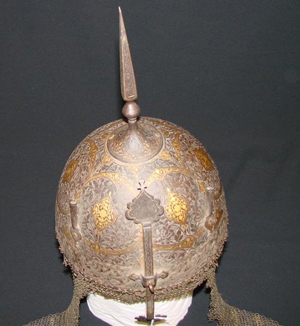 Heavy original gold damascene adorns this Qajar dynasty Indo-Persian khula khud battle helmet, which is pre-1850. The Qajars ruled Iran from 1794 to 1925. The well-preserved helmet has a $2,000-$4,000 estimate. Image courtesy Professional Appraisers & Liquidators LLC.