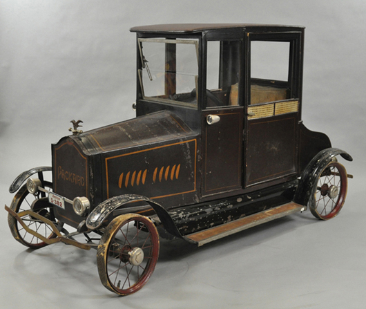 Circa-1924 Packard coupe pedal car, wicker trim, functional doors, fancy eagle hood ornament, $25,000-$35,000. Image courtesy Bertoia Auctions.