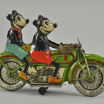 Circa-1932 Tippco (Germany) lithographed-tin clockwork motorcycle, 9¼ inches long with desirable toothy, five-fingered depictions of Mickey and Minnie Mouse, $23,000-$28,000. Image courtesy Bertoia Auctions.