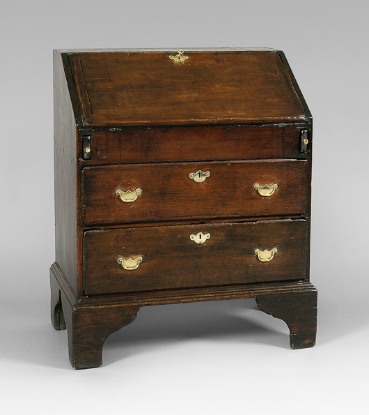 Tom Gray purchased this Queen Anne child’s desk (est. $3000/$6000) from Elliot and Grace Snyder Antiques, in 1983. It is a duplicate of the first antique he ever owned. From New England, 1730-1750, it measures 35 ¾" X 30 ¼" X 16 ½."   