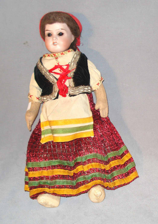About a dozen folk art-style dolls, like this nice-looking 15-inch gypsy doll, will be sold. Image courtesy Gordon S. Converse & Co.