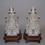 Foo dogs accompany a pair carved ivory statues of an emperor and empress. Exquisitely detailed throughout, the sculptures have a $10,000-$15,000. Image courtesy of Bill Hood & Sons Art & Antique Auctions.