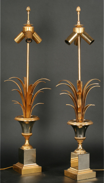 A pair of 1960s French Maison Charles table lamps in bronze chrome reached $3,800. Image courtesy Kamelot Auctions.