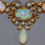 Important circa-1900 Art Nouveau necklace reputed to have once belonged to iconic American interior designer Elsie de Wolfe (a k a Lady Mendl, 1865-1950), comprised of more than 45 carats of cabochon, oval-cut and teardrop-shape Australian fire opals, 23 in all. Additional accents include 19 freshwater pearls and 52 single-cut diamonds. Retains original heart-shape leather case. Featured on Leigh and Leslie Keno’s TV show Find! Estimate $60,000-$80,000. Image courtesy of Austin Auction Gallery.