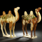 These Chinese Sancai reverse-glazed tomb ware camels are Tang Dynasty and both 21 inches high by16 1/2 inches long. The pair is estimated at $14,000-$18,000. Image courtesy New Orleans Auction Galleries Inc.
