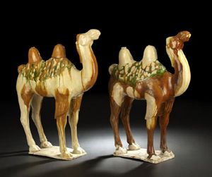 These Chinese Sancai reverse-glazed tomb ware camels are Tang Dynasty and both 21 inches high by16 1/2 inches long. The pair is estimated at $14,000-$18,000. Image courtesy New Orleans Auction Galleries Inc.